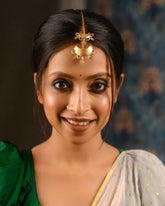 Craftooba Chandrika Crown Maang Tika Where moonlit grace meets the rhythm of handcrafted brass.